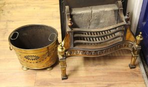 An 18th century style serpentine brass figure grate, with pierced paterae decoration, together