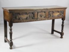 A late 17th century oak dresser base, with three frieze drawers with geometric moulded decoration
