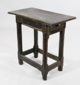 An 18th century and later oak rectangular topped side table, with single end drawer, with