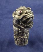 An early 20th century Chinese silver walking cane handle modelled as a roaring kylin with collar and