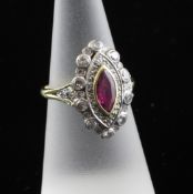 A 1990`s Victorian style 18ct gold, ruby and diamond cluster marquise shaped dress ring, size L.