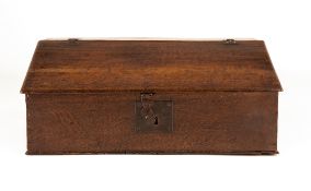 A WILLIAM AND MARY OAK DESK BOX, CIRCA 1690, of slope fronted form, interior with three drawers,