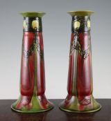 A pair of Minton Secessionist vases, c.1910, with slip trailed dandelion decoration predominantly in