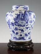 A Chinese blue and white `Hundred Boys` baluster vase, Kangxi period, some seated at a scholar`s