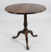 A George III mahogany circular tripod wine table, with turned column and downswept supports, W.2ft