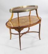 A George III design oval satinwood two tier etagere, inlaid with central musical trophies and