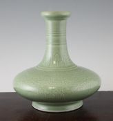 A Chinese celadon glazed squat bottle base, Yongzheng seal mark but later, with carved scroll