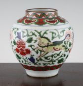 A Chinese wucai squat baluster vase, 17th century, painted with three different coloured Buddhist