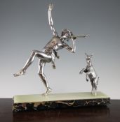 A French silvered metal figure group of Pan and a dancing goat, on a rectangular onyx and marble