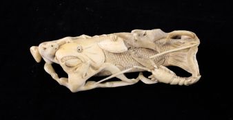 A Japanese ivory okimono, Meiji period, carved as a fish with three rats and a lobster clambering
