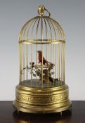 A 20th century German singing bird automaton, modelled as two birds within a wire cage, on