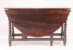 A WILLIAM AND MARY OAK GATELEG TABLE, CIRCA 1690, the oval top above one drawer, on bobbin turned