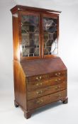 A George III mahogany bureau bookcase, with a pair of astragal glazed doors over fall front above