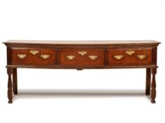 A GEORGE II OAK DRESSER, MID 18TH CENTURY, the moulded rounded top above three ogee moulded drawers,
