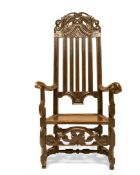 A LARGE QUEEN ANNE OAK ARMCHAIR, CIRCA 1705, the arched pierced cresting rail above a slatted back