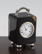 An Edwardian silver mounted tortoiseshell carriage timepiece, with Roman dial, silver handle, on bun