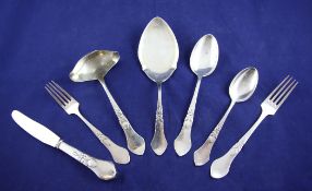 A part suite of 1920`s and later Danish silver cutlery by Carl M. Cohr, the planished handles with