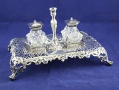 A Victorian pierced silver desk stand, of rectangular form, with interwoven scroll and stud border