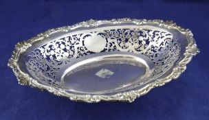 An Edwardian pierced silver fruit bowl, of oval form, with scroll border, Elkington & Co Ltd,