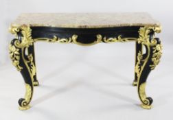 A decorative marble top serpentine shape console table, with ebonised and gilt base, carved with C