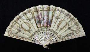 An early 19th century French mother of pearl and pleated silk fan, decorated with classical wreaths,