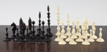 An 18th / early 19th century French bone chess set, with slender turned decoration, with natural