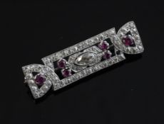A 1930`s/1940`s white gold, ruby and diamond set open work brooch, of rectangular form with demi-