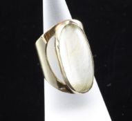 A stylish mid 1960`s 9ct gold mounted rutilated rock crystal set dress ring, with oval cabochon