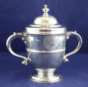 A good early George I Brittania standard silver two handled cup and cover by Paul de Lamerie, of