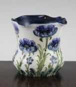 A Moorcroft MacIntyre Florian blue poppy vase, c.1905, of baluster form with a flared neck, brown