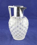 A late Victorian silver mounted hobnail cut glass claret jug, of baluster form, with engraved
