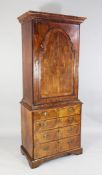An 18th century walnut secretaire cabinet, fitted a single cupboard door with raised arched panel