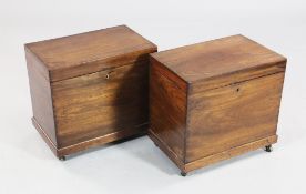 A pair of 19th century mahogany rectangular boxes, with hinged lids, plinth bases and castor feet,