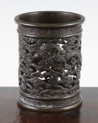 A Chinese bronze brush pot, 19th century, pierced and cast in relief with dragons amid scrolling