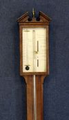 A George III mahogany stick barometer, with silvered scale signed F.Cometti, Lewes, with integral
