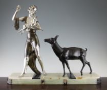 A French 1930`s silvered and patinated metal figure group, of a young lady holding a fawn with