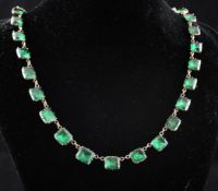 A 19th century French gold, silver and green paste set necklace, set with thirty four graduated