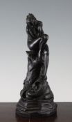 A rare Wedgwood black basalt figure of a nymph, c.1800 the rockwork base pierced possibly for use as