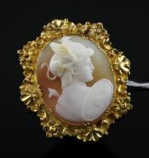 A gold mounted cameo brooch, carved with the head of Jupiter to sinister, with ornate foliate