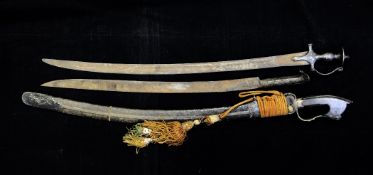 A Turkish yatagan with sadeli inlaid horn handle together with an Indian talwar and one other