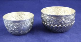 A Victorian demi spiral fluted silver bowl, with repousse floral decoration, William Comyns, London,