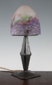 A French Art Nouveau wrought iron table lamp, with domed Muller Freres mottled glass shade, 16in.