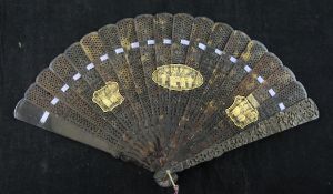 A Chinese export tortoiseshell brise fan, 19th century, the guards carved in relief with figures