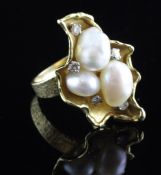 An 18ct gold, baroque pearl and diamond dress ring, modelled as "berries in a leaf", with textured