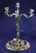 A 20th century silver plated three branch four light candelabrum, modelled as a tree, with foliate