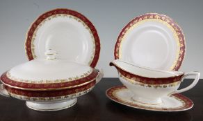 A Royal Worcester bone china Arundel pattern fifty six piece dinner service, with gilt fine leaf and