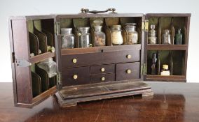 A 19th century mahogany apothecary box, the hinged front opening to reveal a fitted interior with