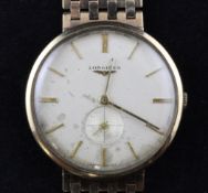 A gentleman`s early 1960`s 9ct gold Longines manual wind wrist watch, with baton numerals and