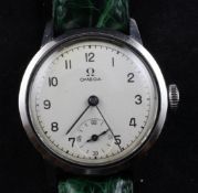 A gentleman`s early 1940`s stainless steel Omega "boy`s size" manual wind wrist watch, with Arabic