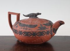 A Wedgwood rosso antico Egyptian design teapot and cover, early 19th century, with sphinx, canopic